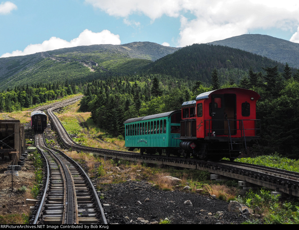 MWCR 3 - Abenaki passes our train heading up the mountain just above Waumbek Water Tank